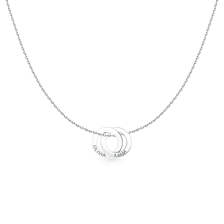 Close-up of the interlocking rings of the Amity Necklace with engraved names